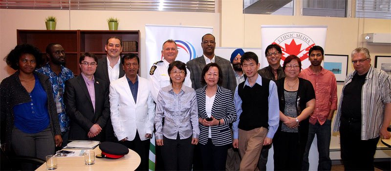 Delwar Jahid with police chief Rod Knecht and the editors of ethnic media in Edmonton